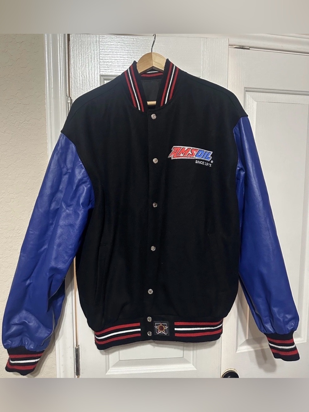 AMSOIL Black Varsity Bomber Jacket with Blue Leather Sleeves